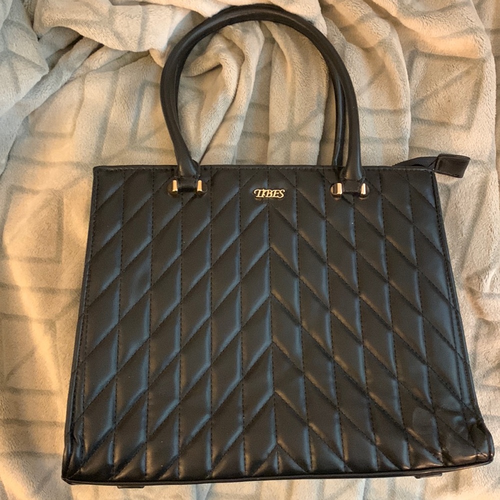 top-handle handbag is made of soft high quality PU leather